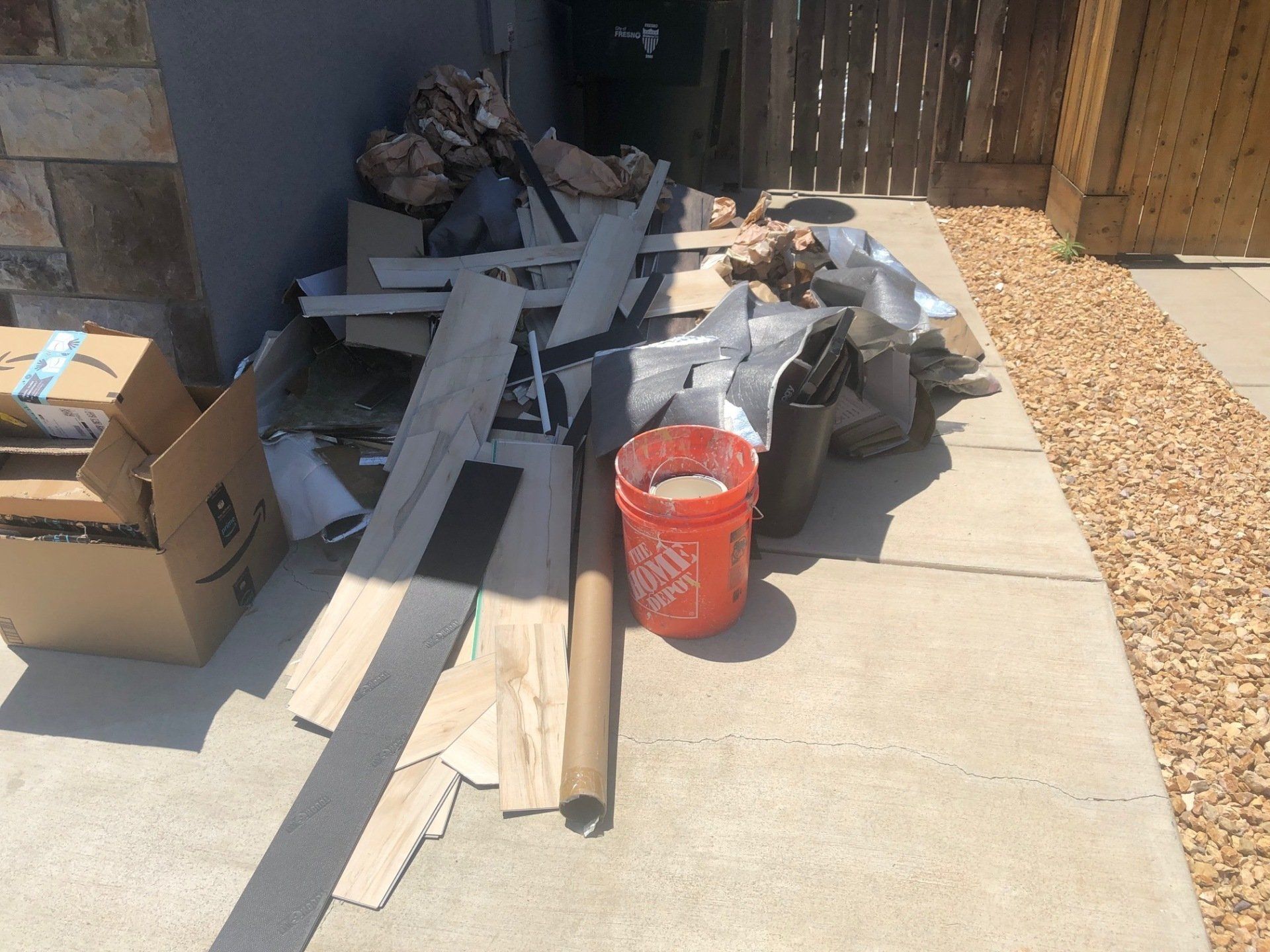 Curbside junk pile ready for Junk Champions pickup in Rancho Cucamonga